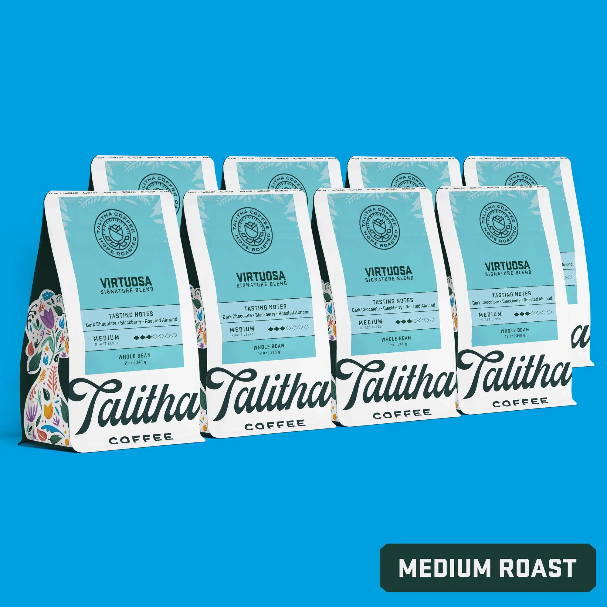 bags of Talitha Virtuosa blend medium roast coffee on blue background